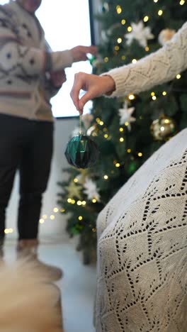 couple decorating christmas tree