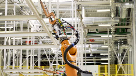 automated welding robot in a manufacturing facility