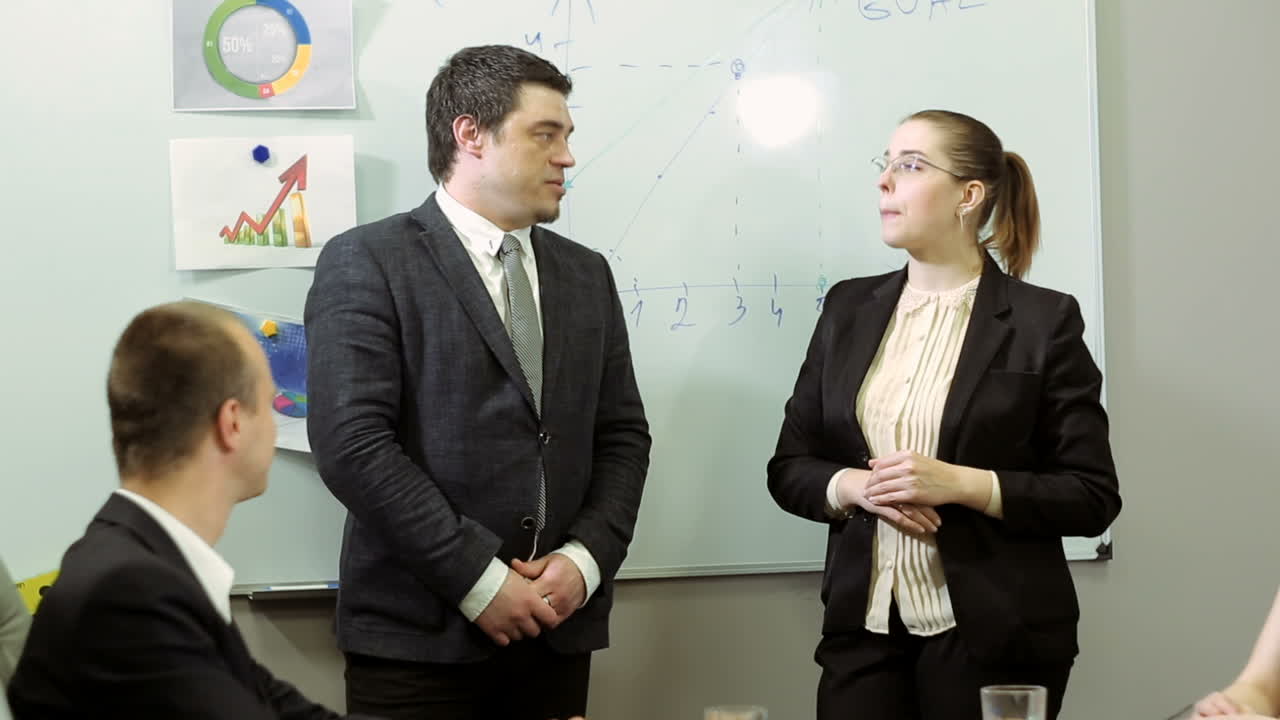 Mixed Group In Business Meeting. Business colleagues in conference meeting room during presentation