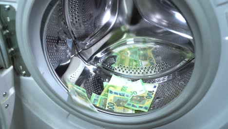 money hanging to dry with clothespin - euro money banknotes after  washing machine - illegal cash 50, 100 €  and mafia money laundering - increase in the cost of living, energy and gas
