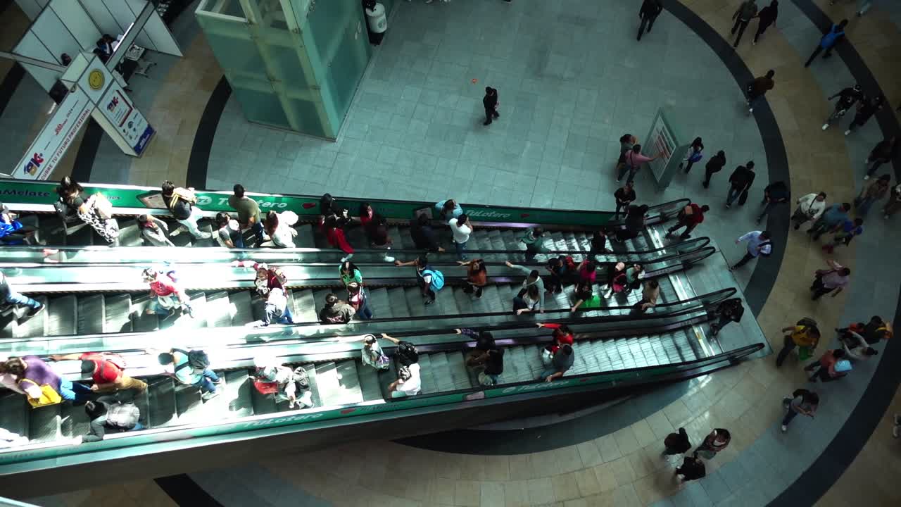 Aerial view of moving escalators with people in Mexico City. CDMX. Mall.