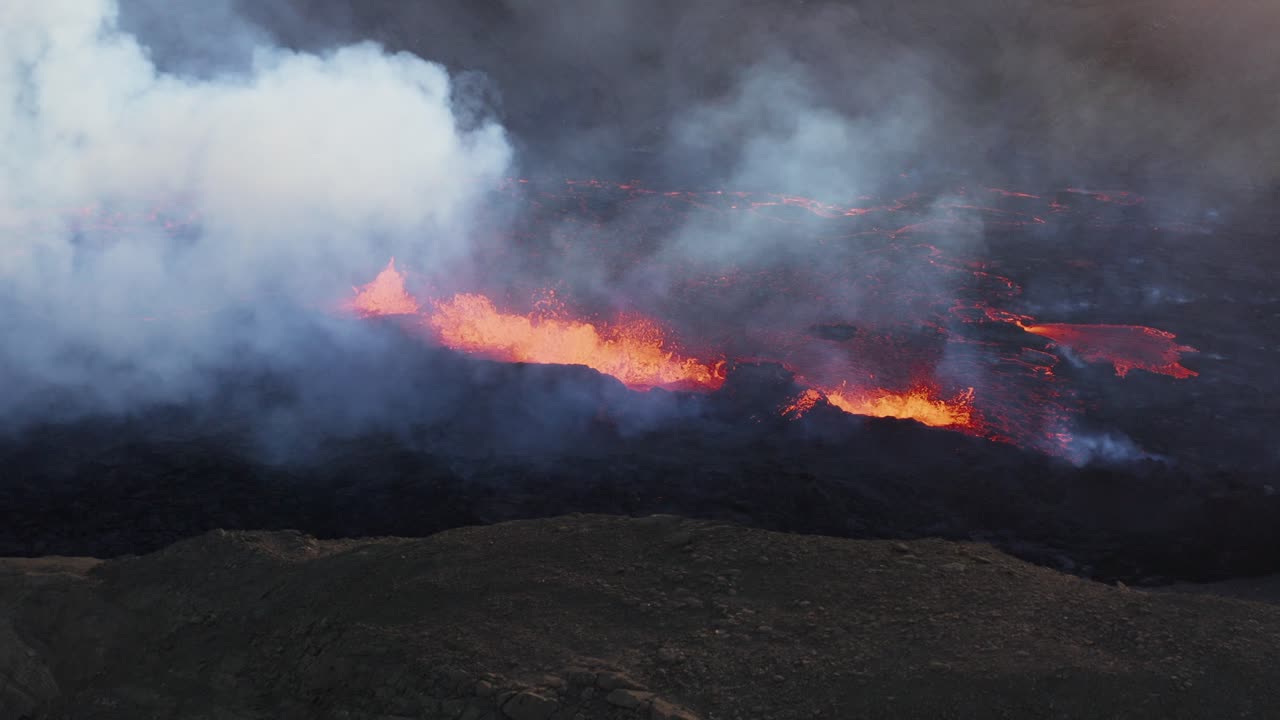Dangerous geothermal landscape with molten lava spewing from earth surface, Fagradalsfjall Iceland