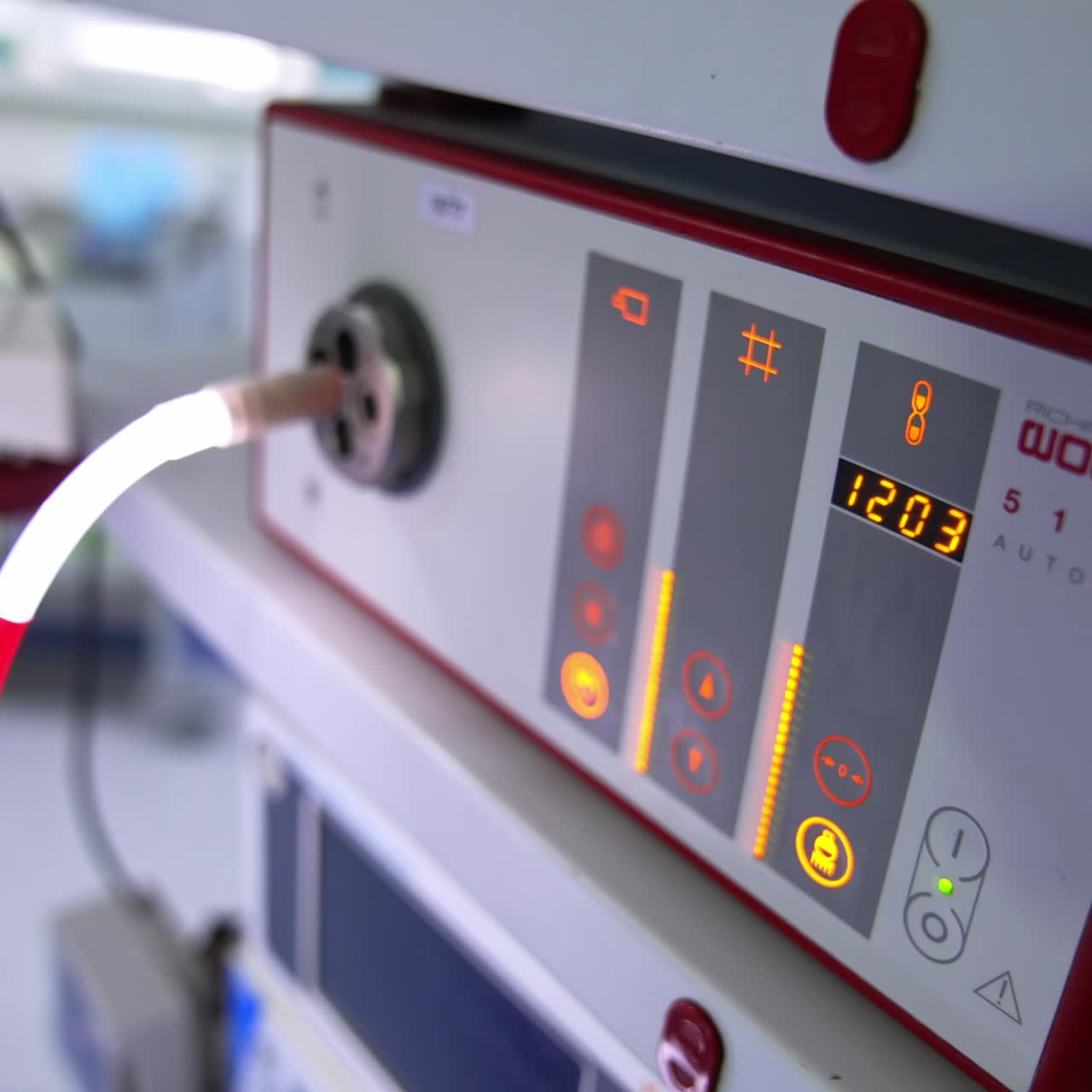 Technological apparatus working in the surgery room. Equipment for modern surgical procedures switched on during the operation. Close up