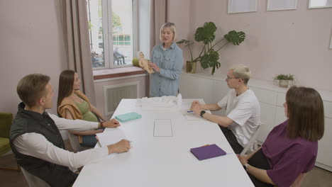 Blonde-teacher-talking-in-class