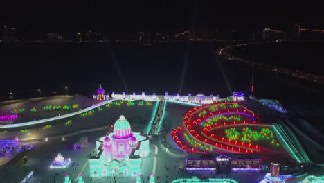 harbin china night aerial: bright colors of cold winter ice festival