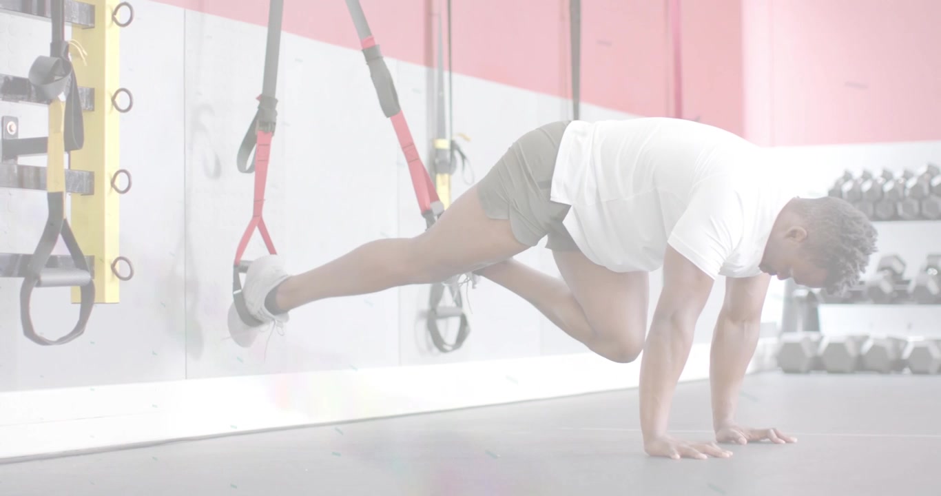 Midadult man feet in straps doing alternating TRX knee tucks, animated reps tracking core strength
