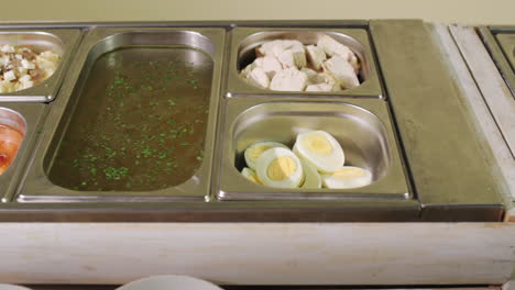 buffet with various dishes in a self-service restaurant. slider shot