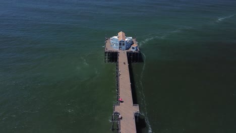 fly down oceanside pier with a slow tilt up