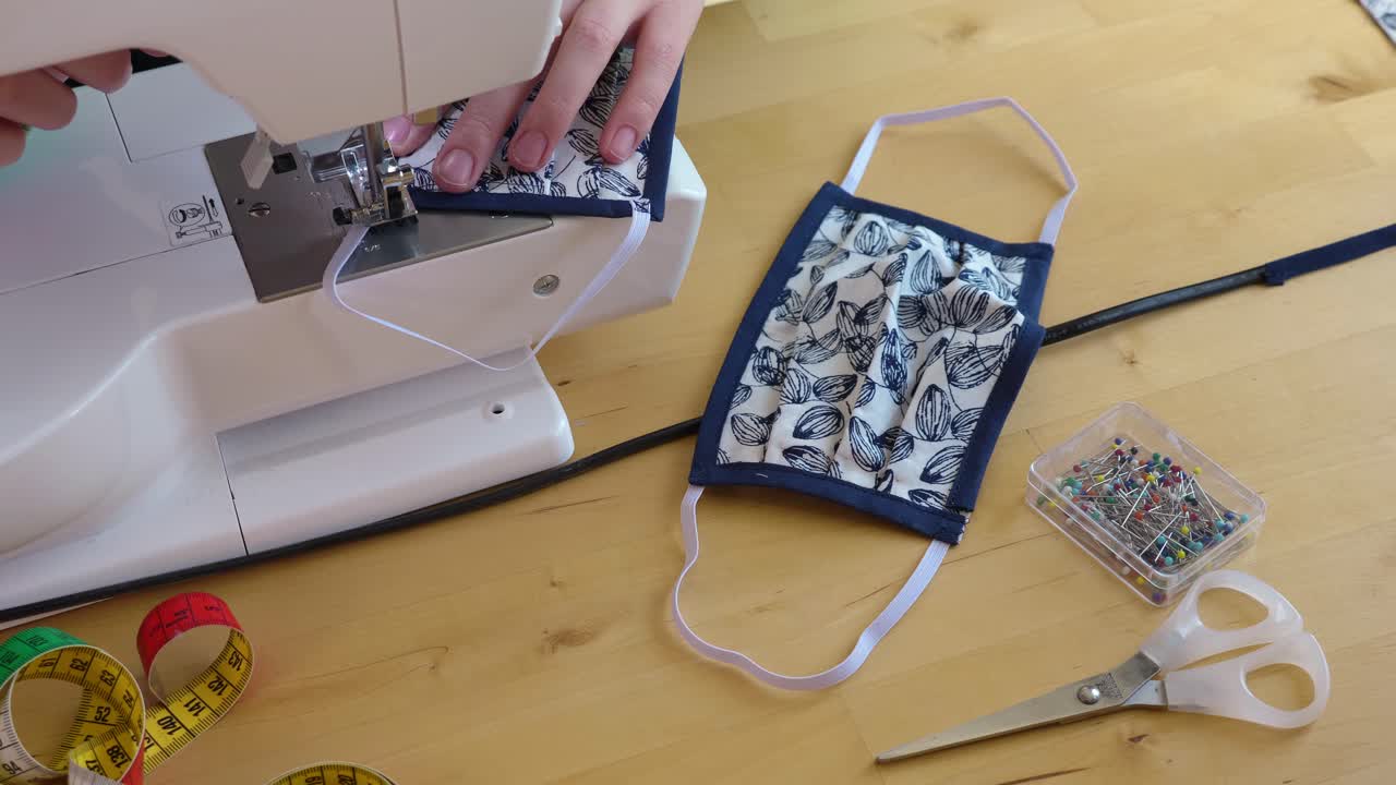 Woman Sewing Homemade Face Masks on a Sewing Machine