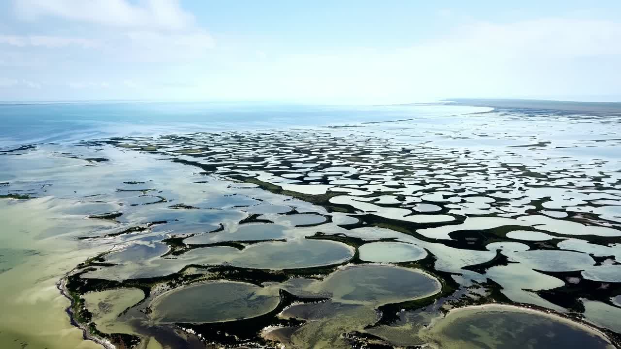 aerial view of shallow sea and many islands