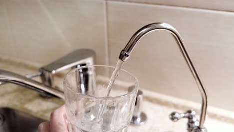 pouring water from a countertop water dispenser