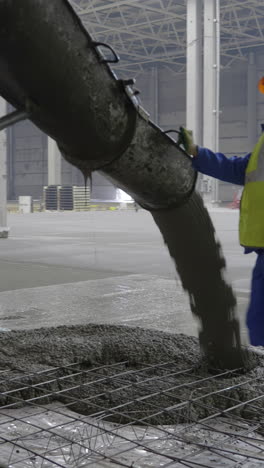 pouring concrete floor at construction site