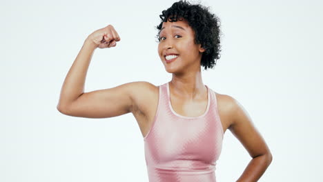 Woman-face,-fitness-and-arm-flex-in-studio