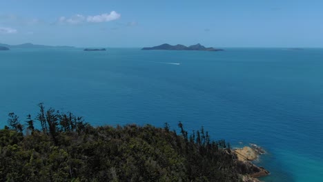 Aerial-forward-panoramic-view-of-coast-near-Whitehaven,-Whitsunday-Island