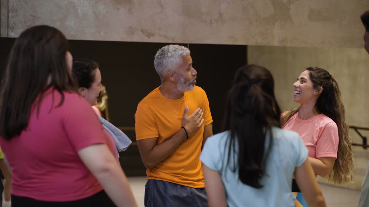 Group of people talking indoors