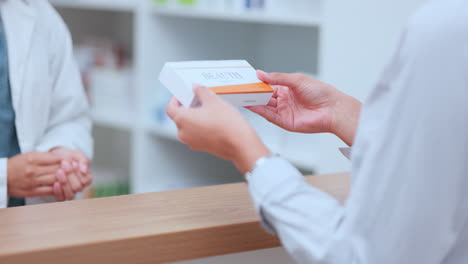 pharmacist giving prescription medication