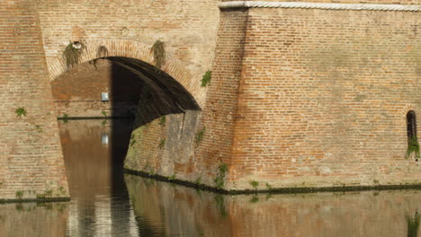 este castle in ferrara, italy, unesco world heritage site, wide shot pan left