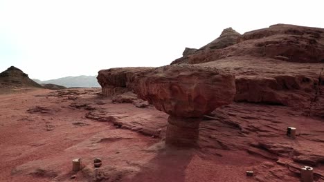 large red rock called the mushroom due to its typical shape in the dry timna park in the negev desert in southern israel