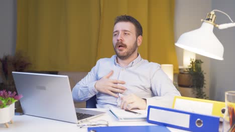 home office worker man is sick and coughing.