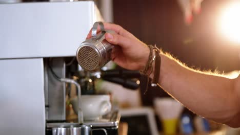 waiter making cup of coffee