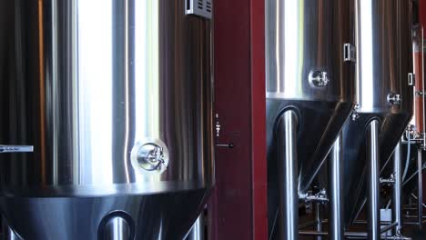 stainless steel tanks in a modern brewery setting