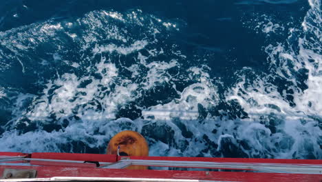 Drop-down-view-of-boat-on-water-Mediterranean-Sea-white-foam