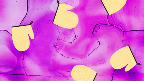 animación de la ilustración de guantes de horno amarillos que caen sobre un fondo rosa