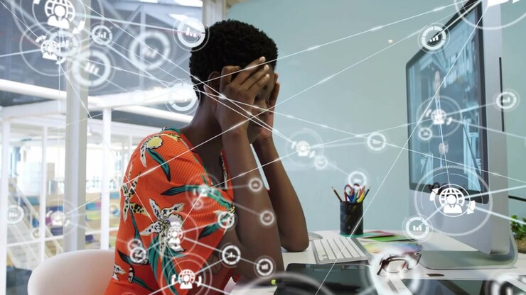 Vertical video: Rubbing head, woman in floral dress overwhelmed as overlay rising at office screen