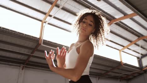 female dancer in an empty warehouse