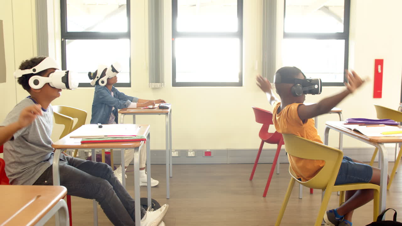 In classroom, diverse multiracial students using vr headsets, exploring virtual reality, at school