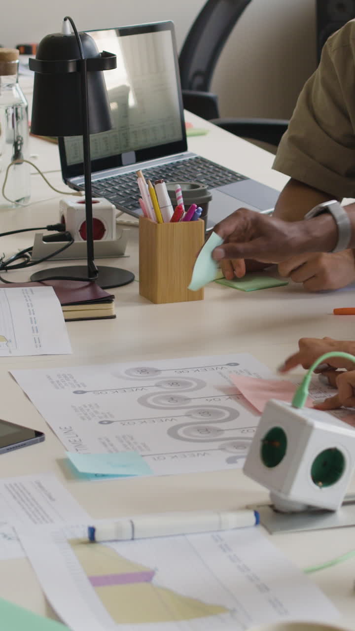 People Collaborating and Working at an Office Desk