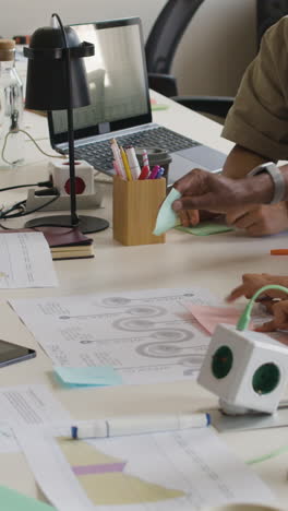 people collaborating and working at an office desk