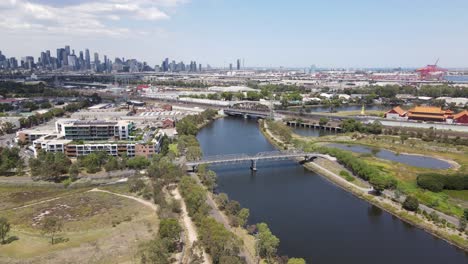 aerial drone over kensington suburb, moving towards melbourne city skyline