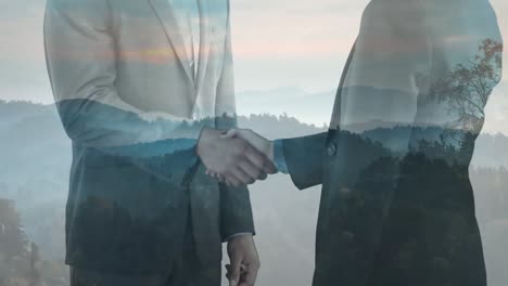 animation of midsection of caucasian businessmen shaking hands over landscape