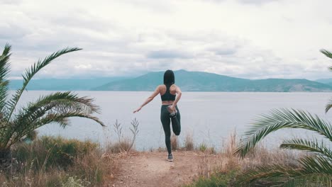 Girl-stretching-in-front-of-the-sea