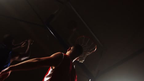 sportsmen playing basketball