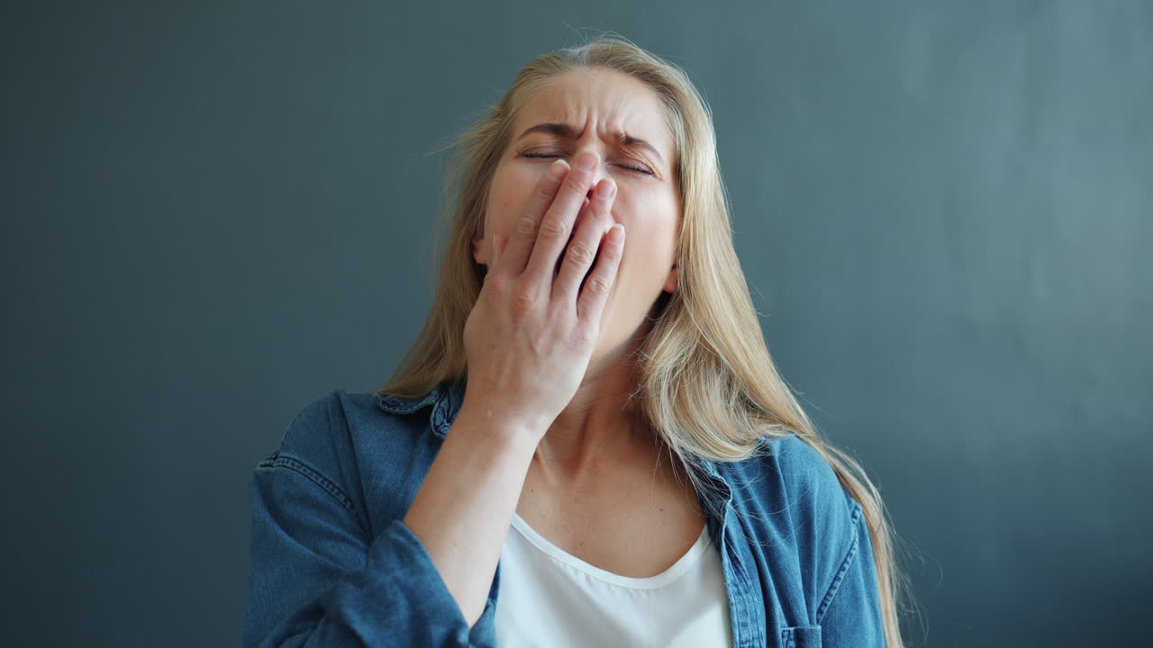 Woman Yawning and Tired