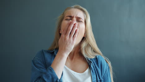 woman yawning and tired