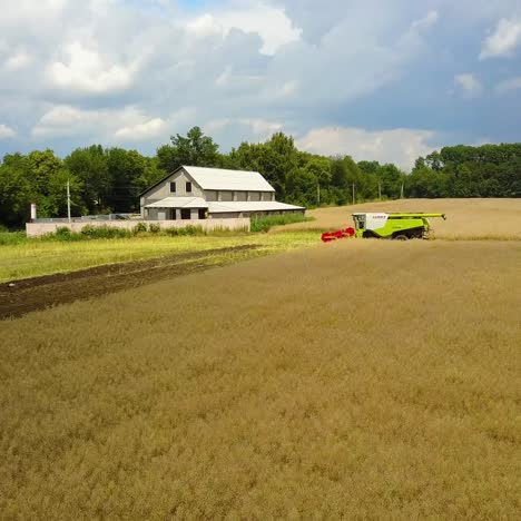 big combine in middle of field
