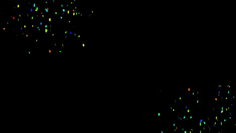 animación de un conjunto de manchas multicolores brillantes que caen sobre un fondo negro