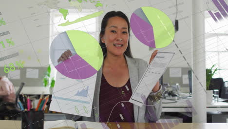 female financial analyst presenting printed charts in office, projecting ar world map and graphs