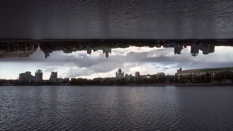 inverted city reflection over river