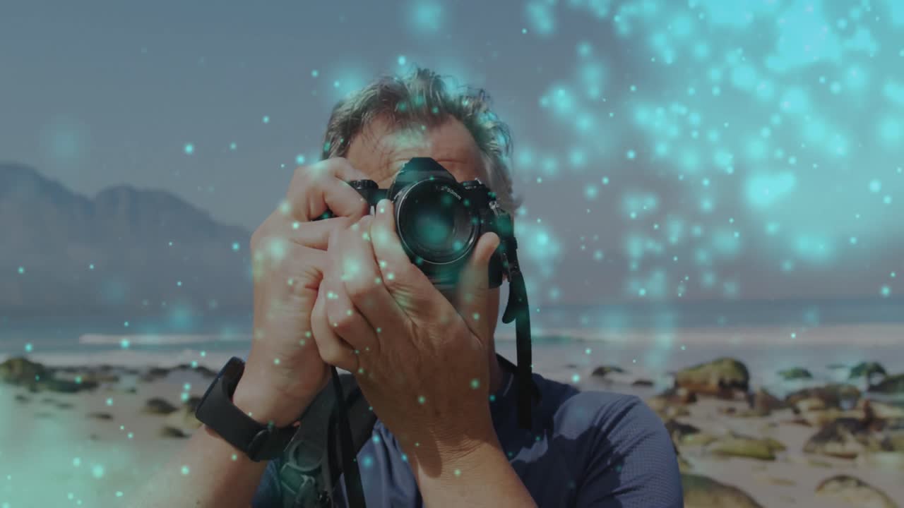 manchas brillantes azules contra caucásico fotógrafo masculino de alto nivel haciendo clic en imágenes con cámara digital