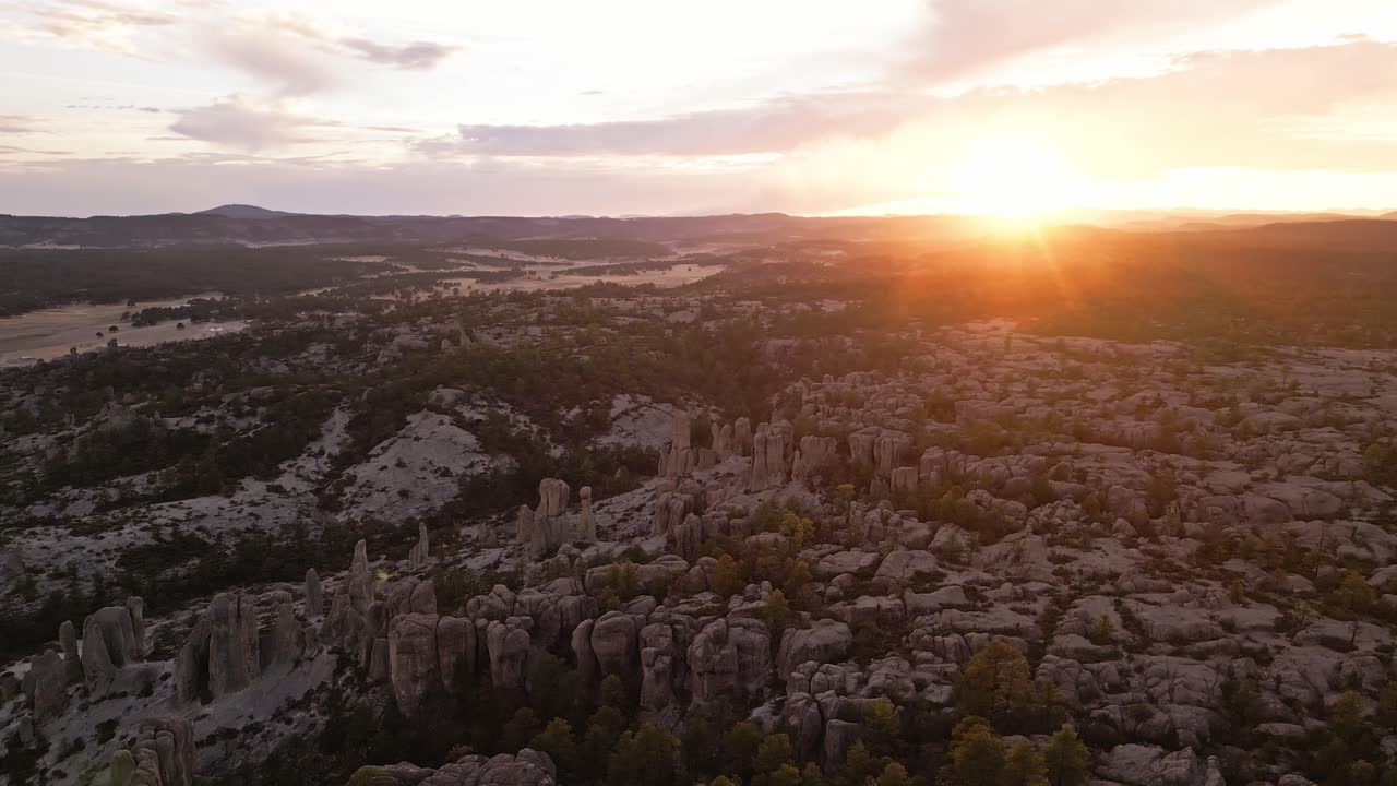Sunset over rocky landscape with unique rock formations in Valle de los Monjes, Chihuahua