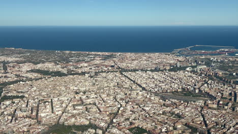 Aerial view of Valencia City center in Spain, in a splendid summer afternoon, recorded from the cockpit of a jet departing from the airport with a view of Harbor and Mediterranean Sea at the back. 4K