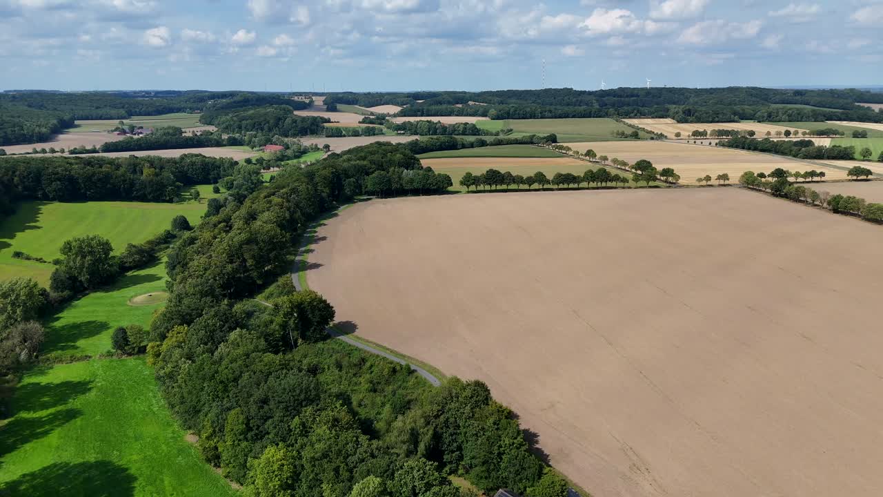 Growing corn, wheat, soybeans, cotton and hay on farm fields in America. Aerial lateral wide shot. Iowa, Illinois, Minnesota, Indiana, Missouri, Nebraska and South Dakota
