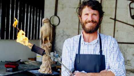 portrait of craftsman holding acetylene torch 4k