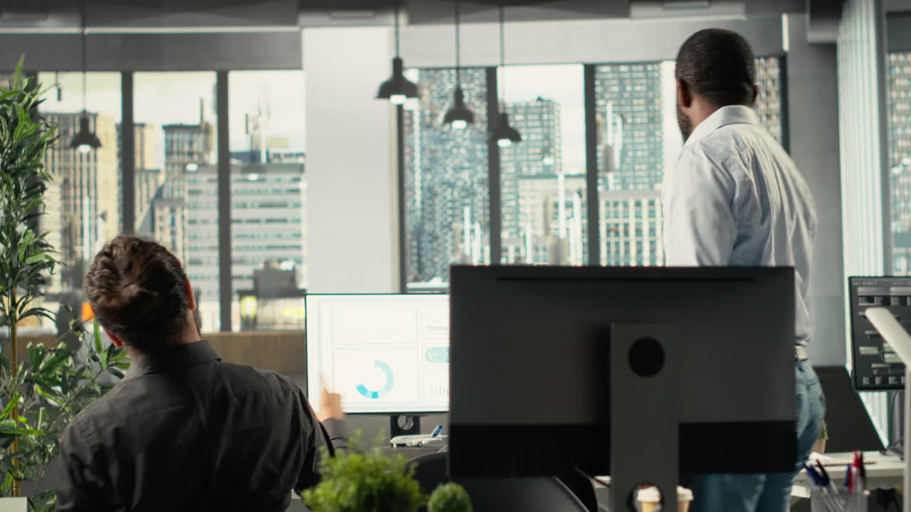 Coworkers in a multinational company greeting each other in office