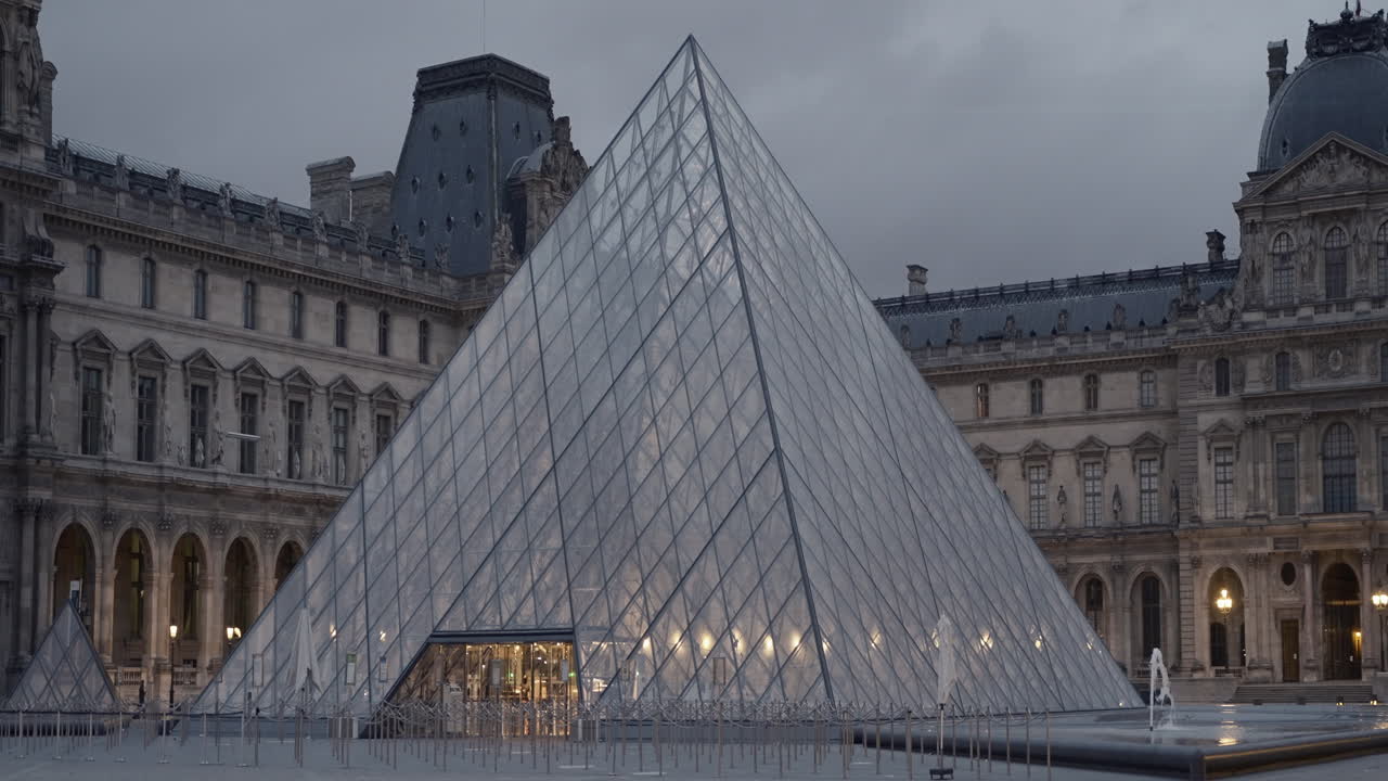 Louvre Pyramid in Paris at Dusk