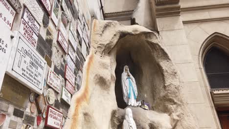 wall of prayers, immaculate virgin and religious messages in christian church at buenos aires argentina